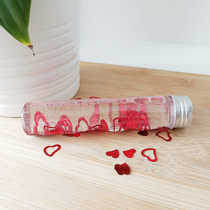 Comprar botella sensorial de la calma Montessori Amor Amor. Purpurinas y confetis