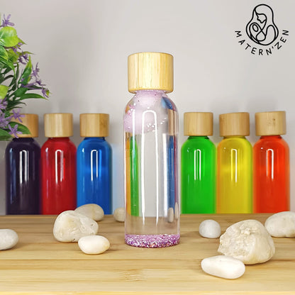 Comprar botella sensorial de la calma con pupurinas y pompones flotantes muy relajante. Tienda especialista en la creación de botellas sensoriales Montessori al mejor precio. Muchos modelos disponibles. 